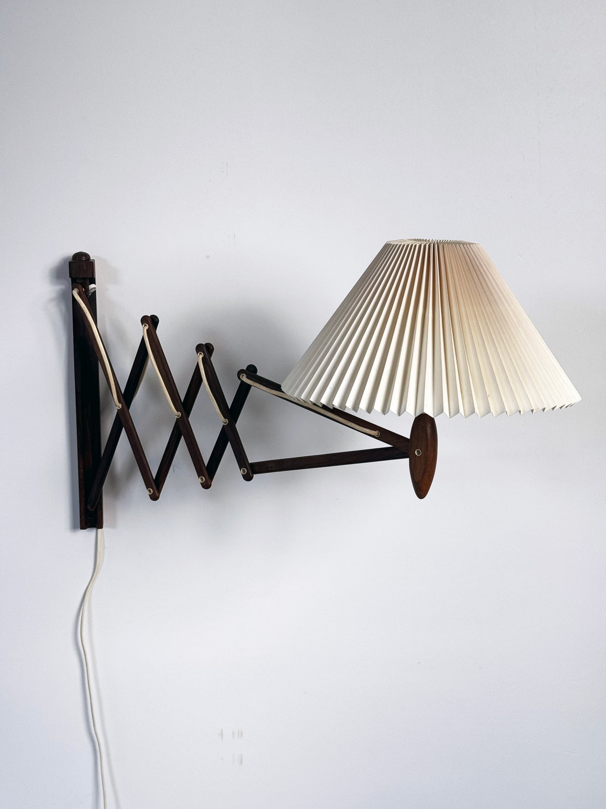 1960s Wall Lamp Model 332 334 by Le Klint in rosewood and pleated shade.