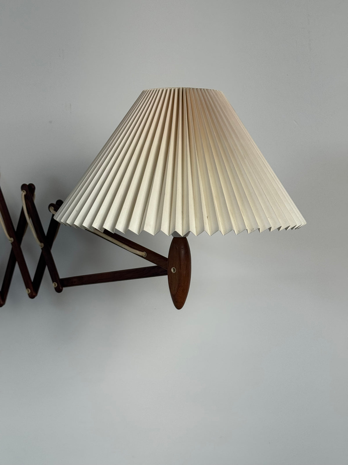 1960s Wall Lamp Model 332 334 by Le Klint in rosewood and pleated shade.