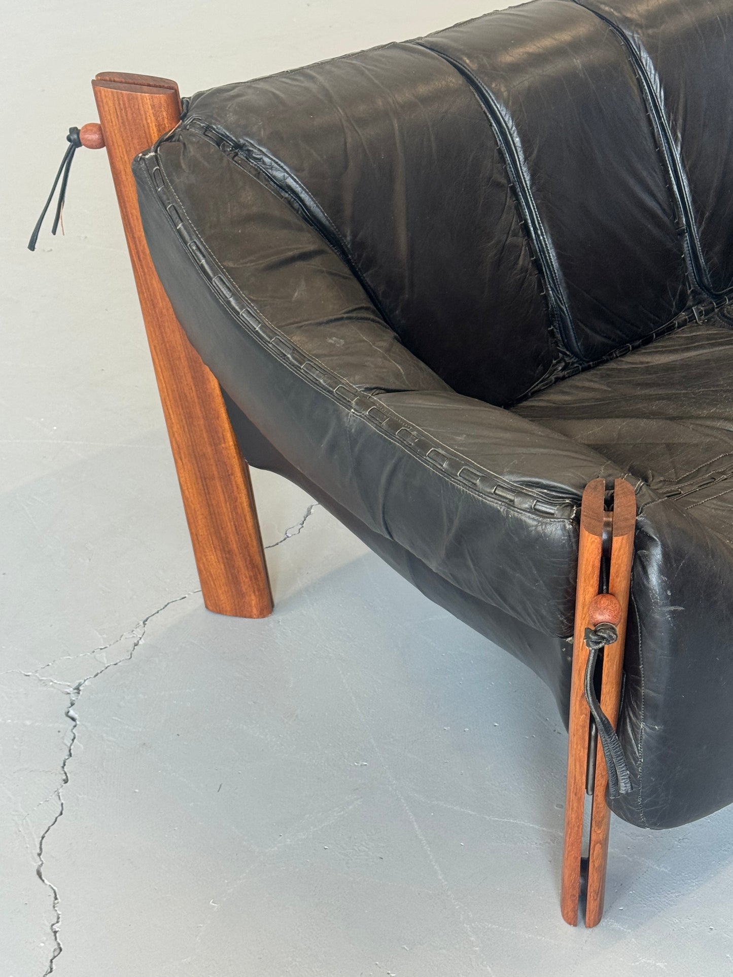 1970s MP-211 Two-Seater Sofa by Percival Lafer in jatobá and original black leather.