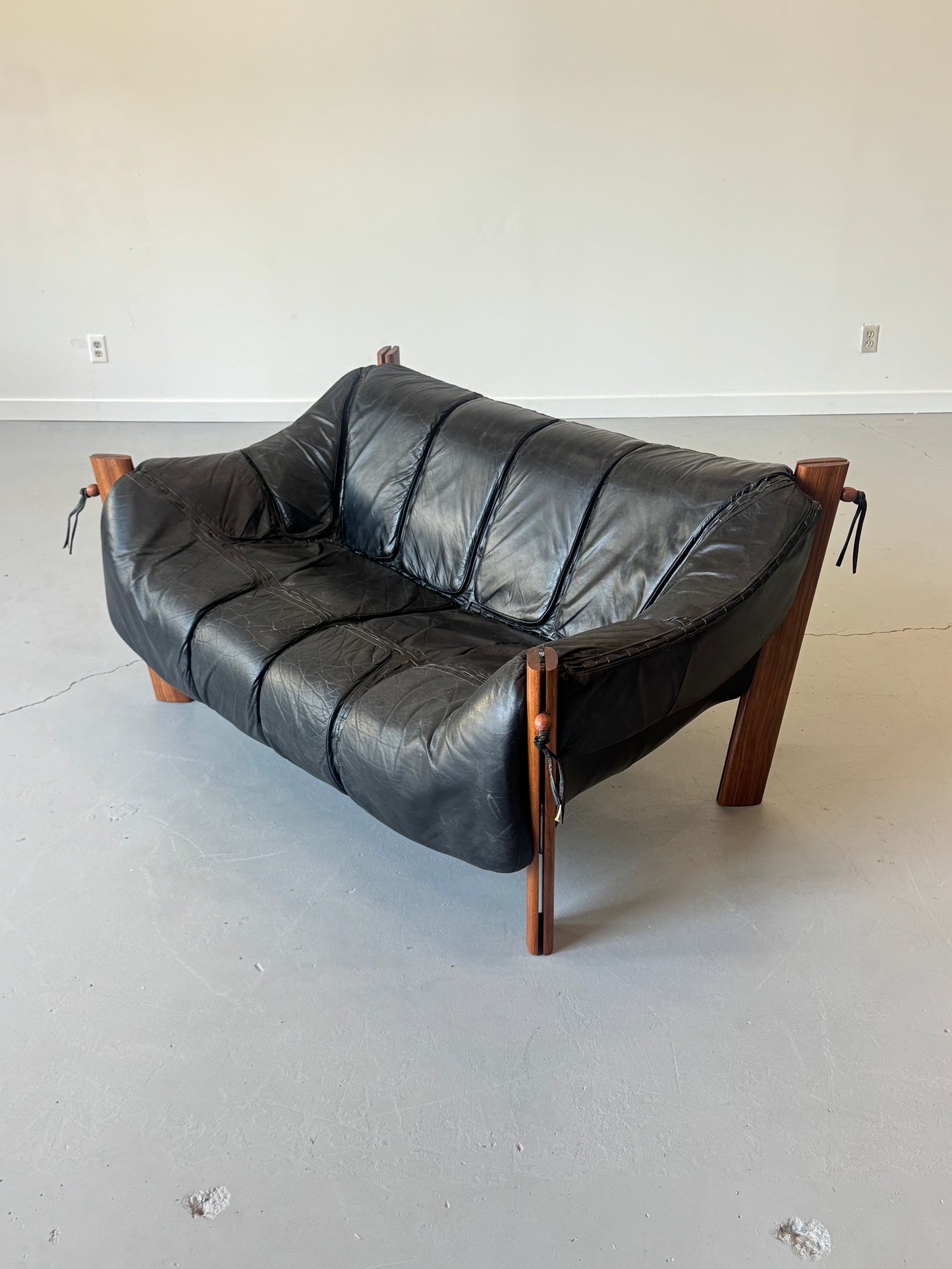 1970s MP-211 Two-Seater Sofa by Percival Lafer in jatobá and original black leather.