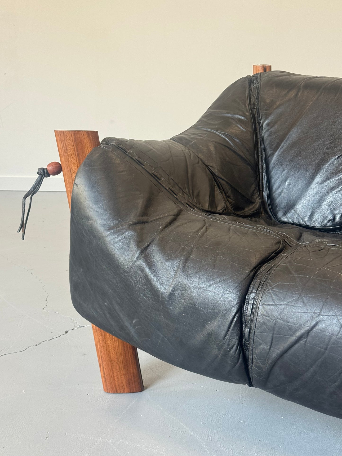 1970s MP-211 Two-Seater Sofa by Percival Lafer in jatobá and original black leather.