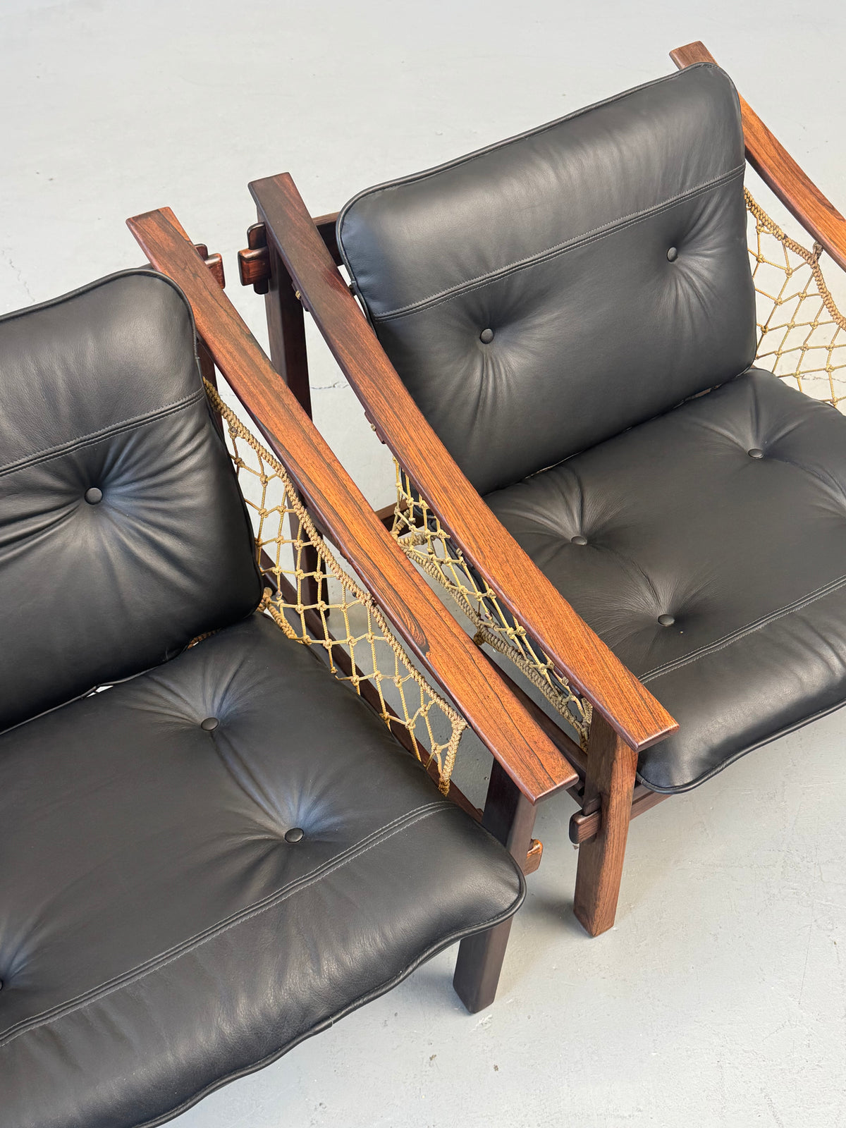 1960s Pair of Amazonas Lounge Chairs by Jean Gillon for Wood Art in Rosewood and Black Leather.