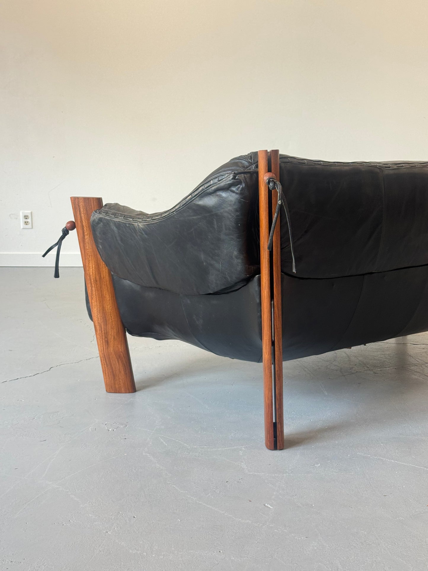 1970s MP-211 Two-Seater Sofa by Percival Lafer in jatobá and original black leather.