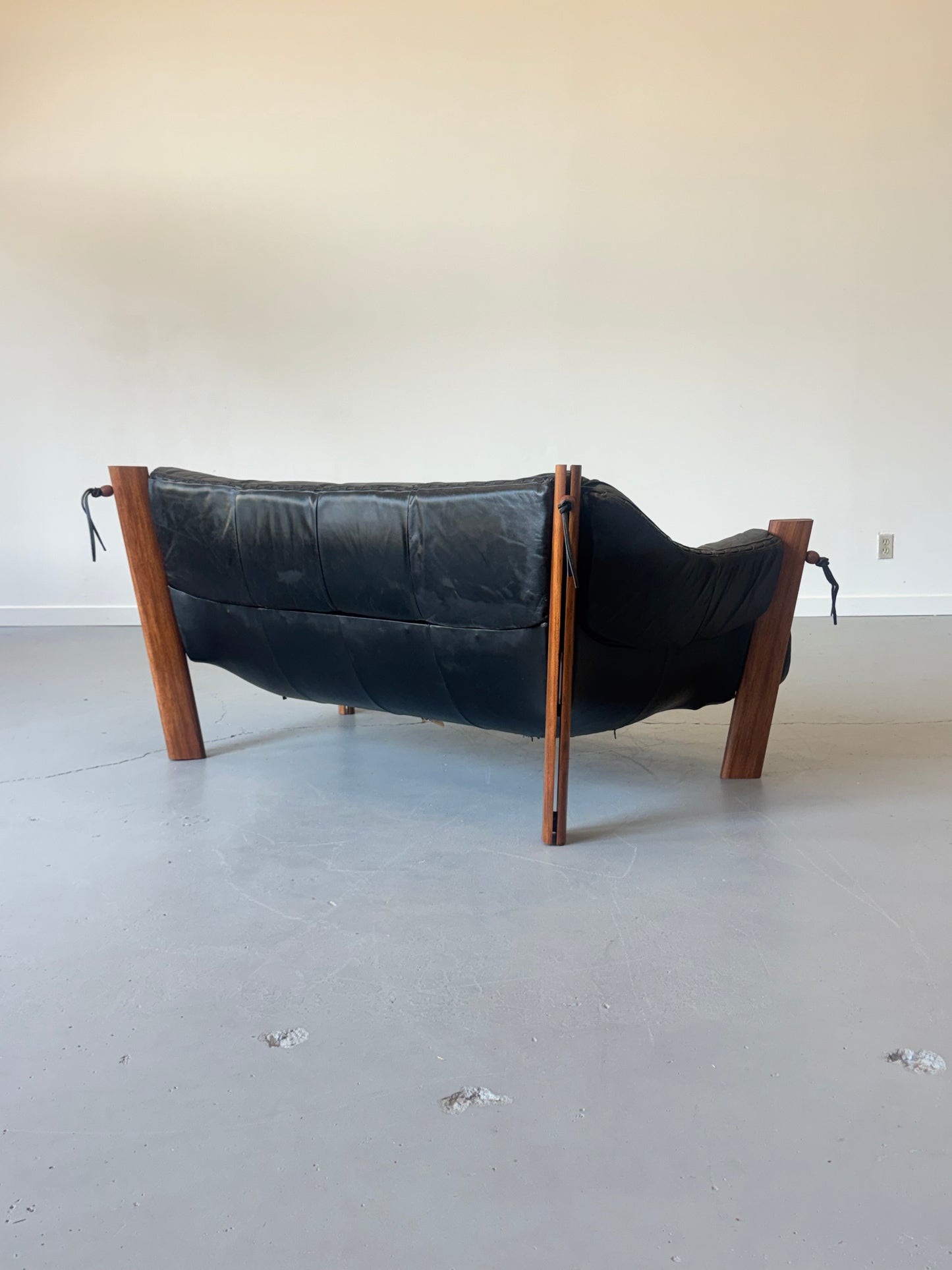1970s MP-211 Two-Seater Sofa by Percival Lafer in jatobá and original black leather.