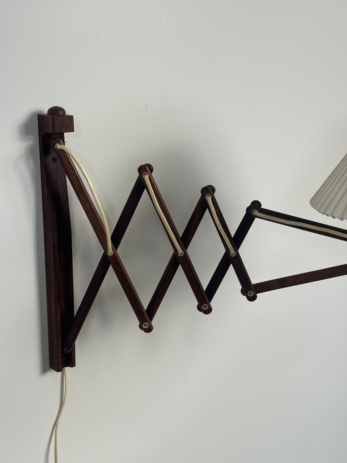 1960s Wall Lamp Model 332 334 by Le Klint in rosewood and pleated shade.