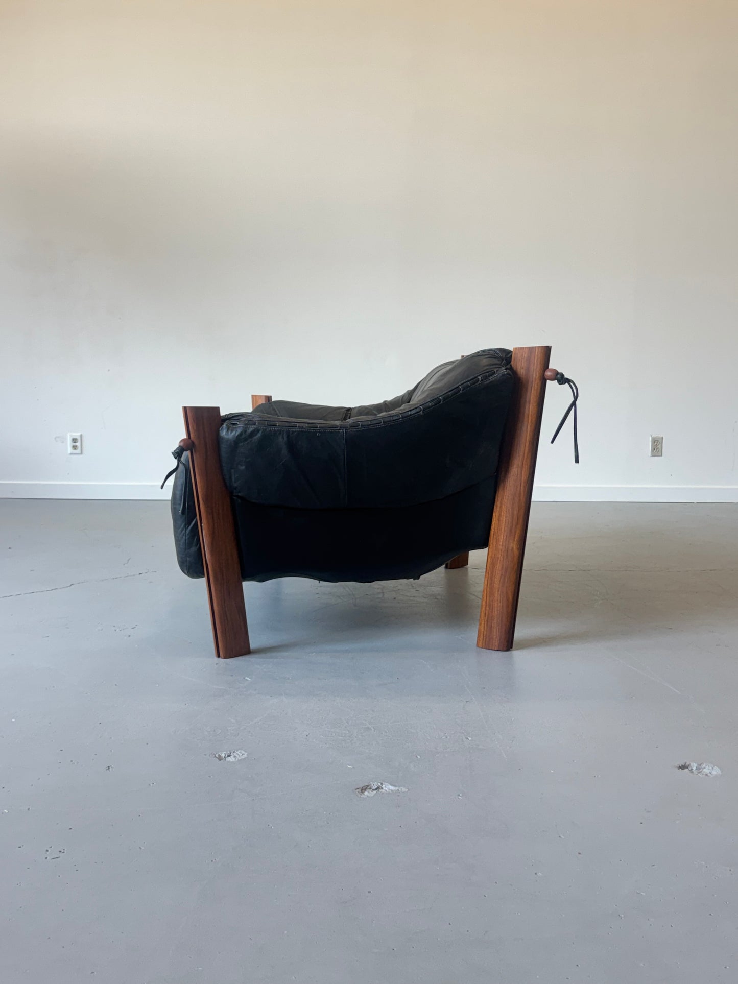 1970s MP-211 Two-Seater Sofa by Percival Lafer in jatobá and original black leather.