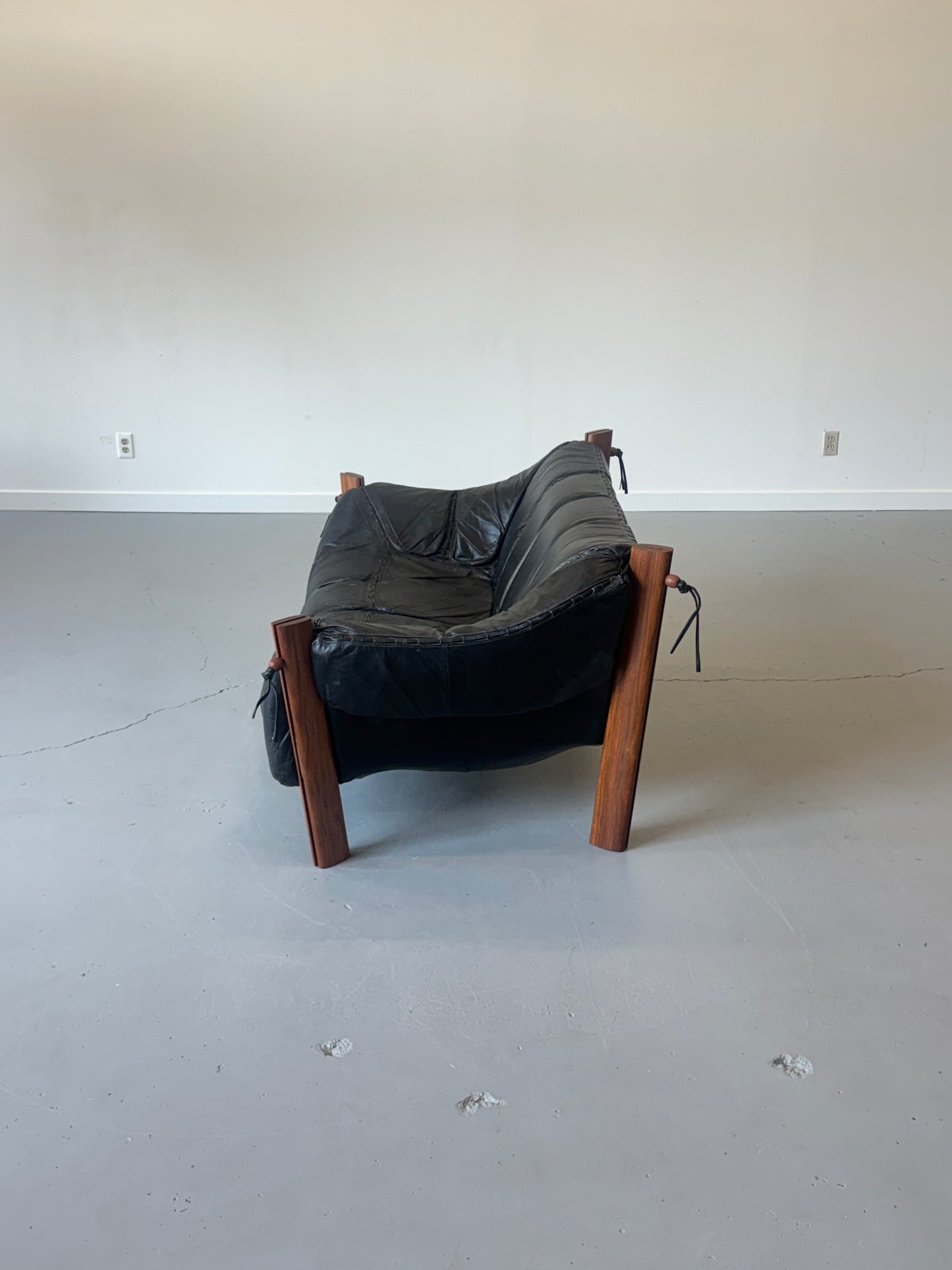1970s MP-211 Two-Seater Sofa by Percival Lafer in jatobá and original black leather.