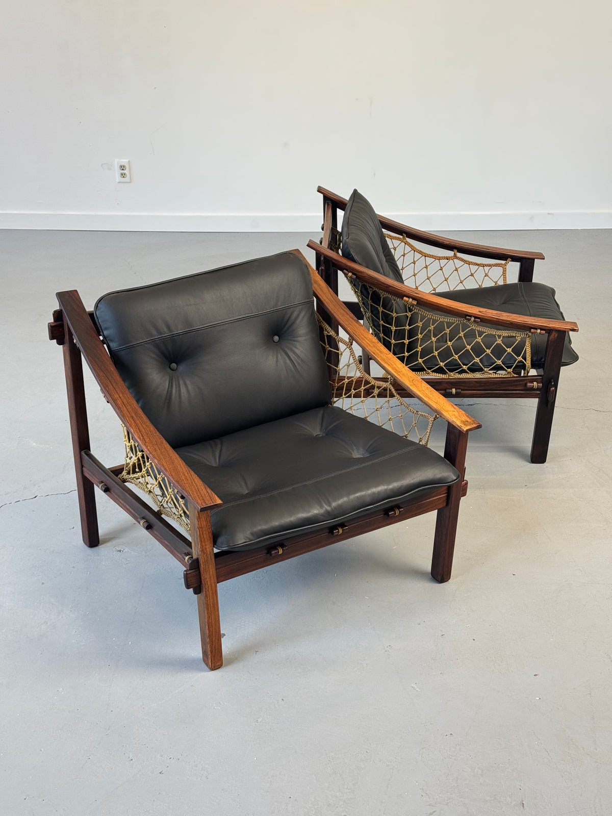 1960s Pair of Amazonas Lounge Chairs by Jean Gillon for Wood Art in Rosewood and Black Leather.