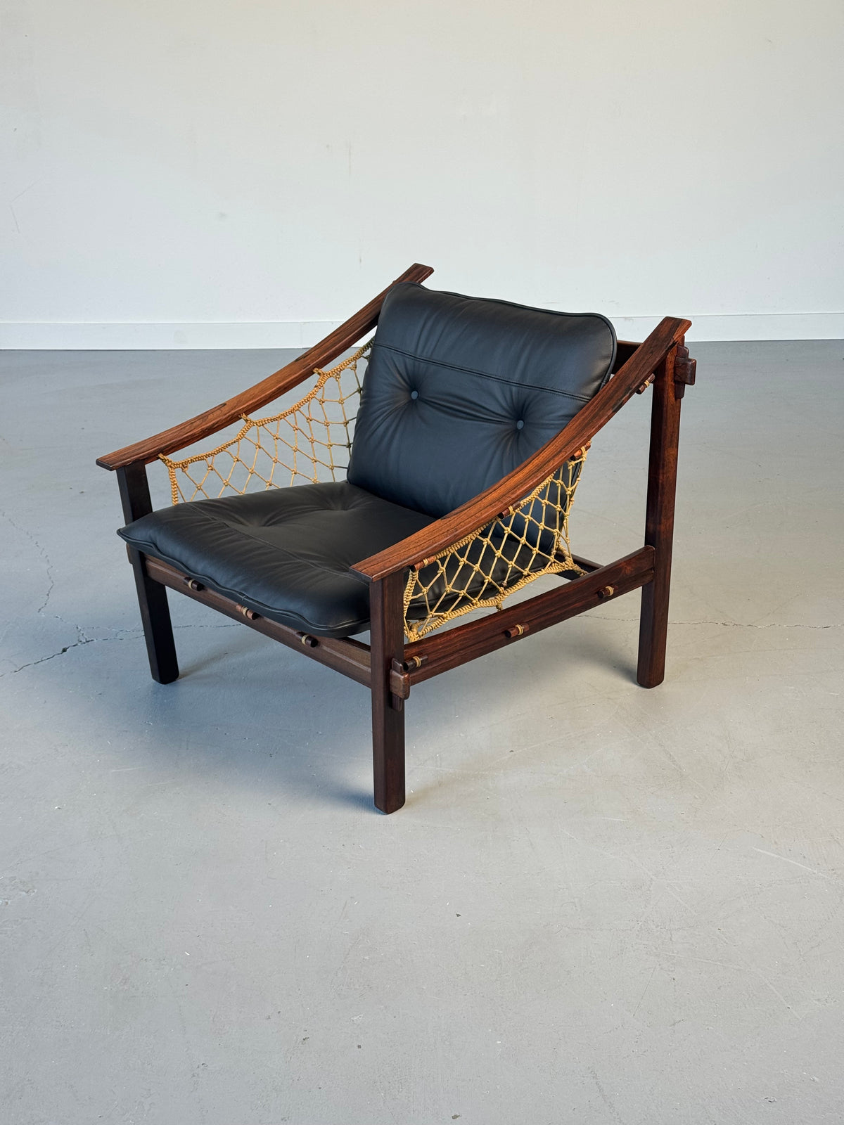 1960s Pair of Amazonas Lounge Chairs by Jean Gillon for Wood Art in Rosewood and Black Leather.