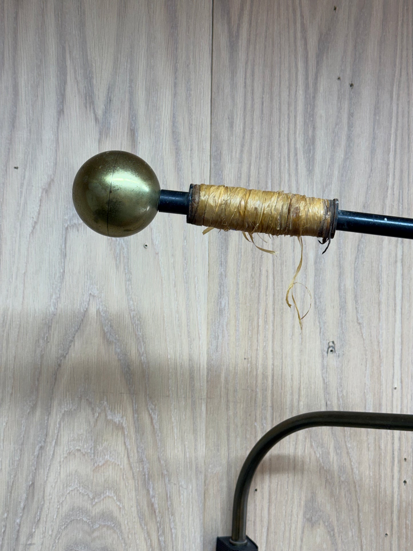 1950s Adjustable French Wall Lamp by Maison Arlus in brass, metal, and rattan