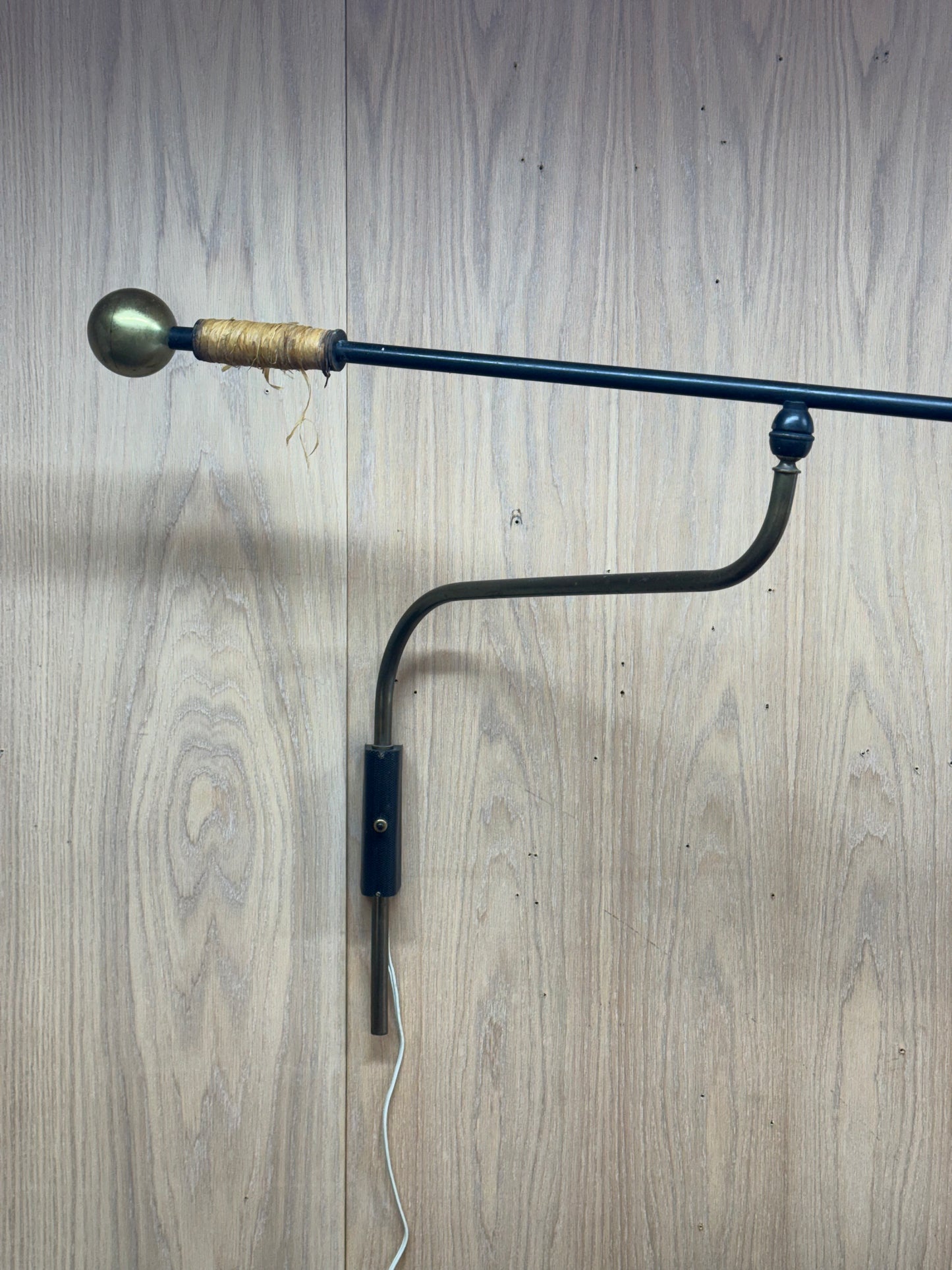 1950s Adjustable French Wall Lamp by Maison Arlus in brass, metal, and rattan