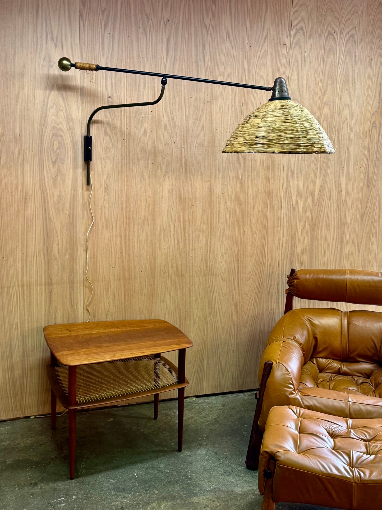 1950s Adjustable French Wall Lamp by Maison Arlus in brass, metal, and rattan