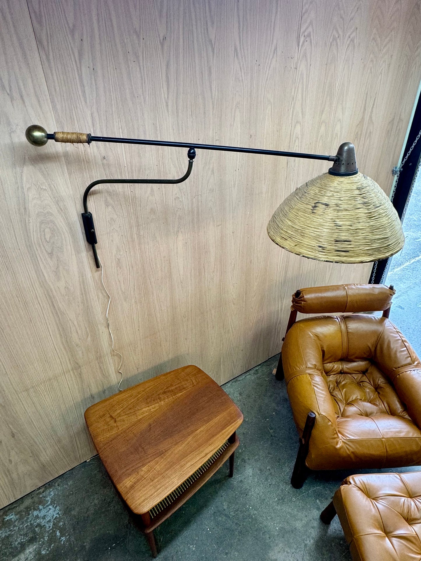 1950s Adjustable French Wall Lamp by Maison Arlus in brass, metal, and rattan