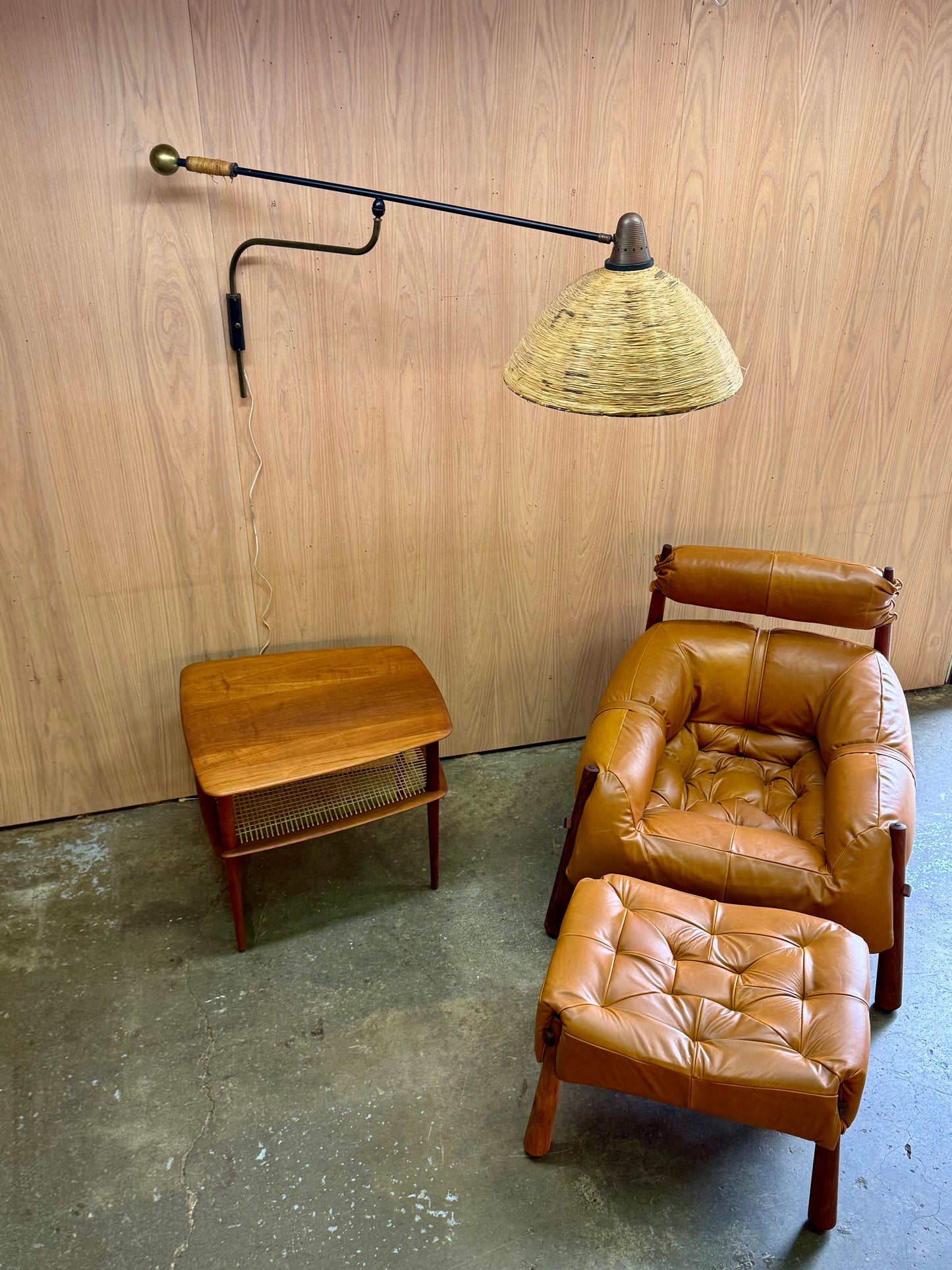 1950s Adjustable French Wall Lamp by Maison Arlus in brass, metal, and rattan